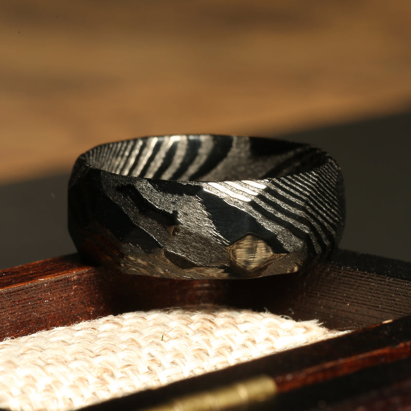 Black Damascus steel ring for men with flowing forged pattern