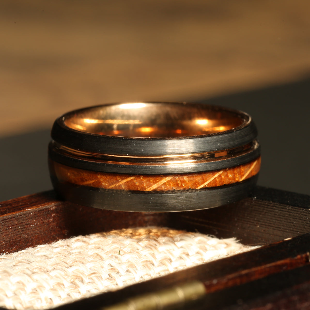 Black tungsten whiskey barrel ring for men with rose gold interior