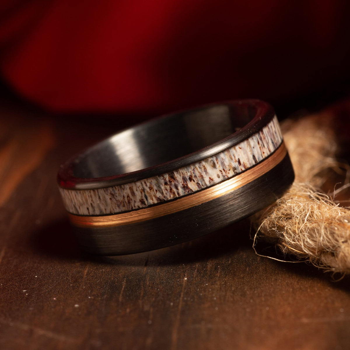 Deer antler black tungsten ring with rose gold center strip