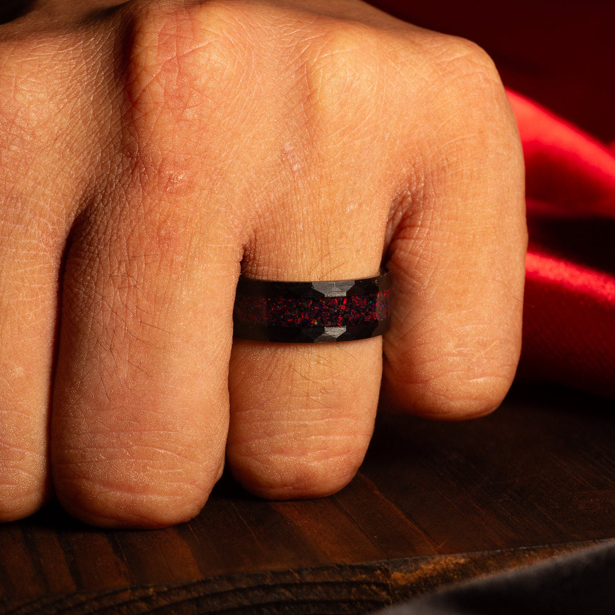 Fire opal wedding rings for couples with dark hammered texture