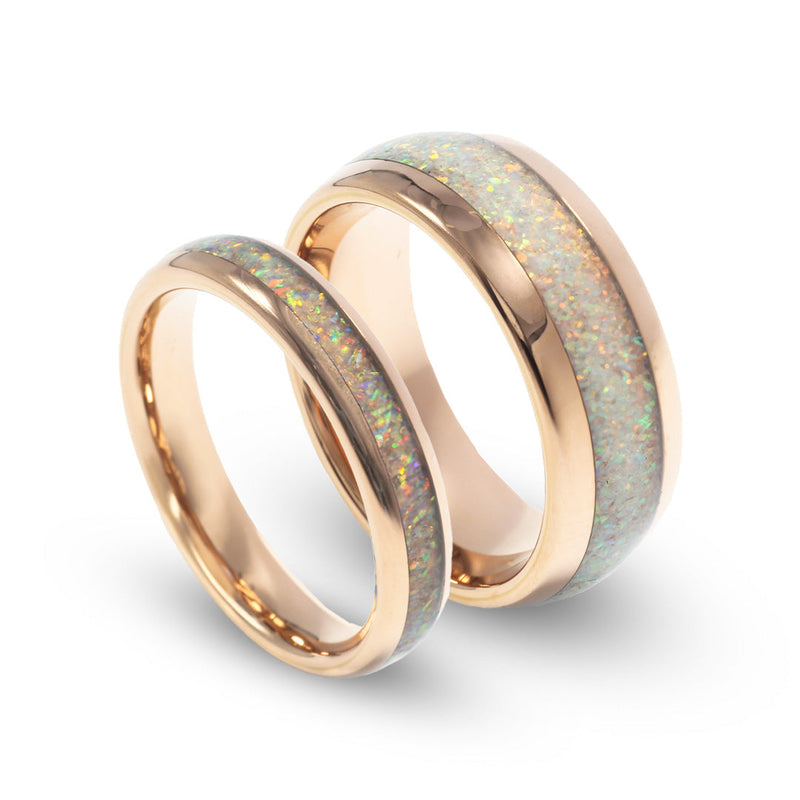 His and hers domed white opal rings with polished rose gold