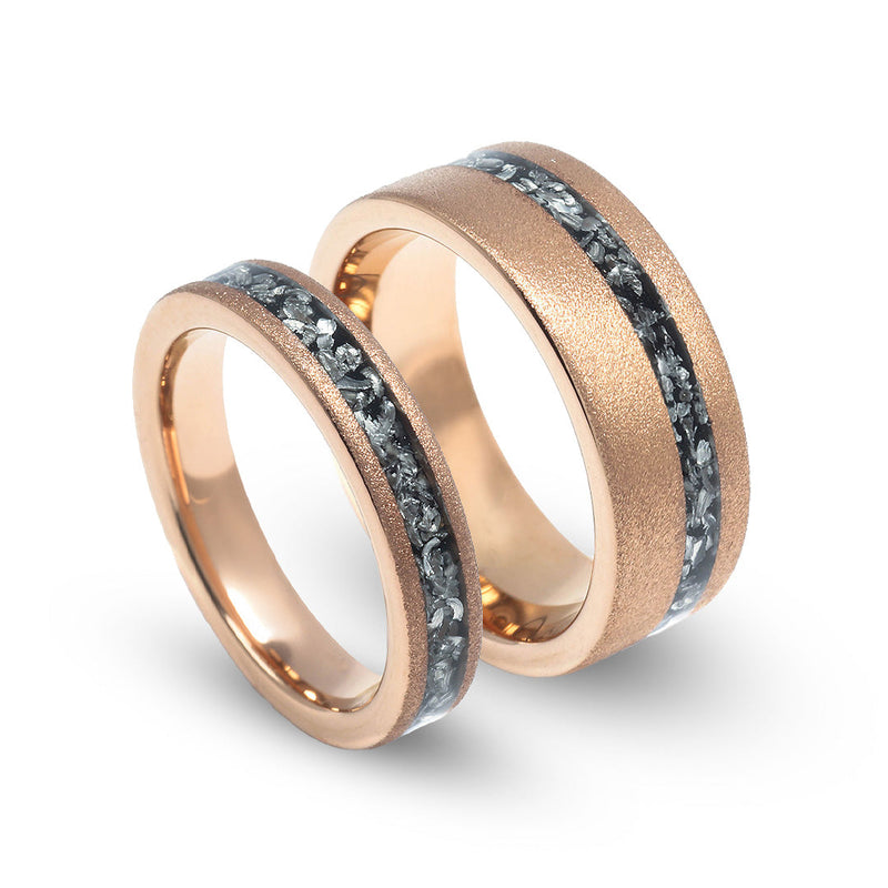 His and hers meteorite rose gold wedding bands with matte finish