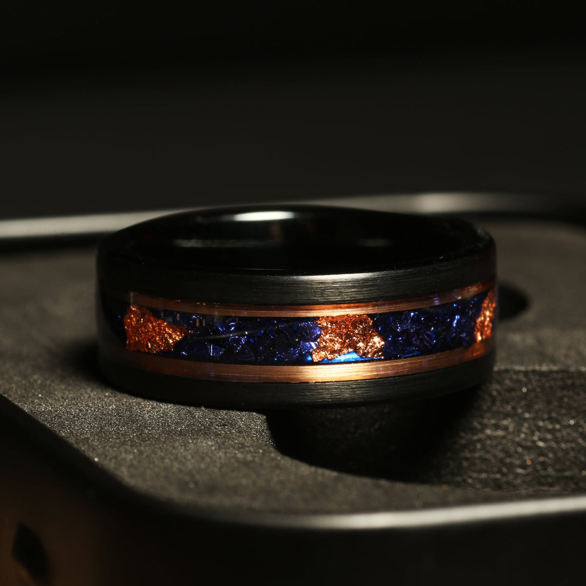 Men’s black tungsten ring with blue sapphire and 24k gold leaf