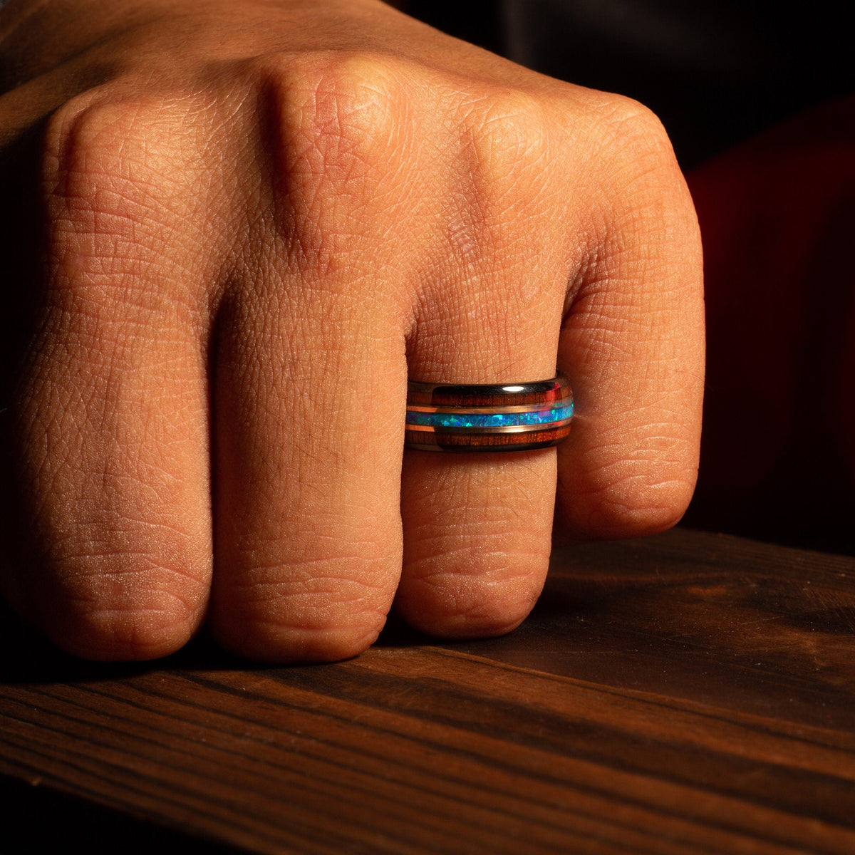 Men’s black tungsten ring with koa wood and blue opal