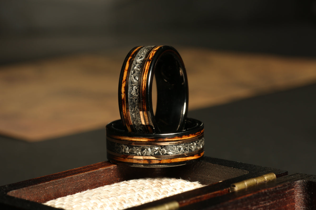 Men’s black tungsten wedding band with genuine meteorite inlay