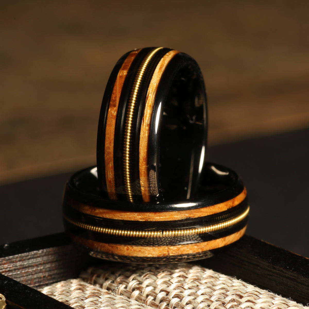 Men’s domed whiskey barrel guitar string ring with black tungsten