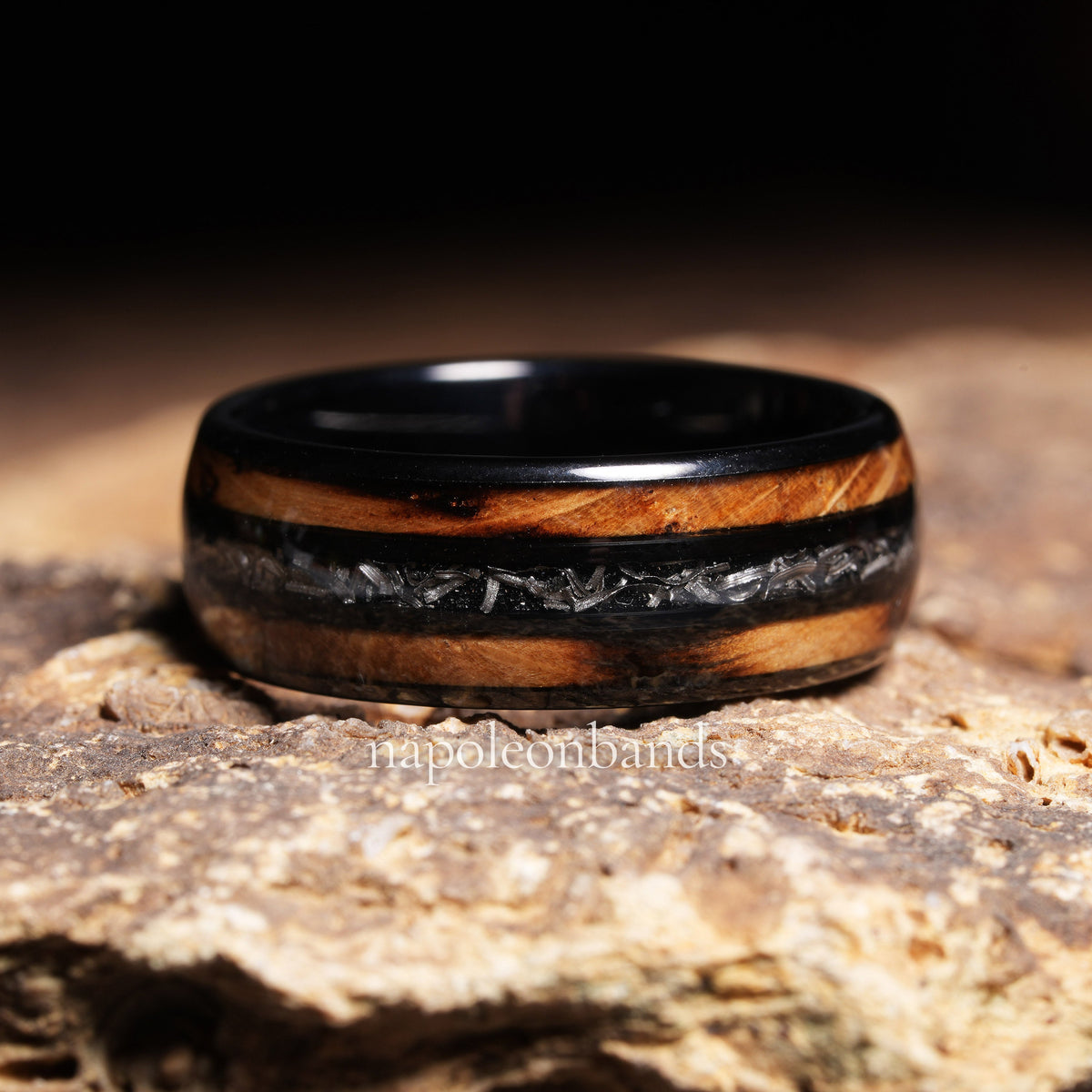 Men’s polished black meteorite wood ring with whiskey barrel inlays