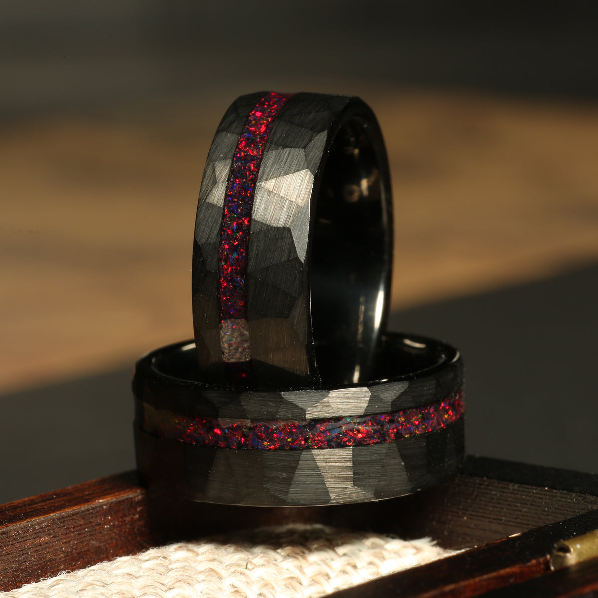 Men’s red fire opal wedding band with black hammered tungsten