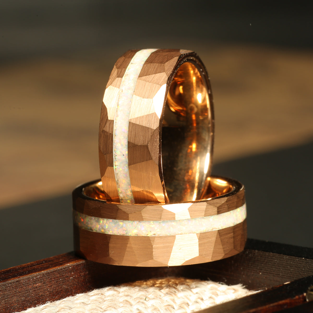 Men’s rose gold white opal wedding band with hammered tungsten