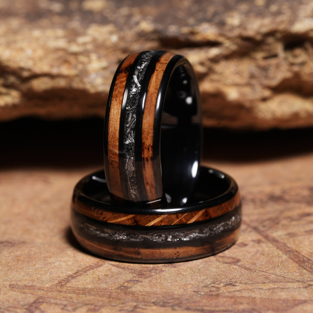 Men’s whiskey barrel meteorite center wedding band with polished black tungsten