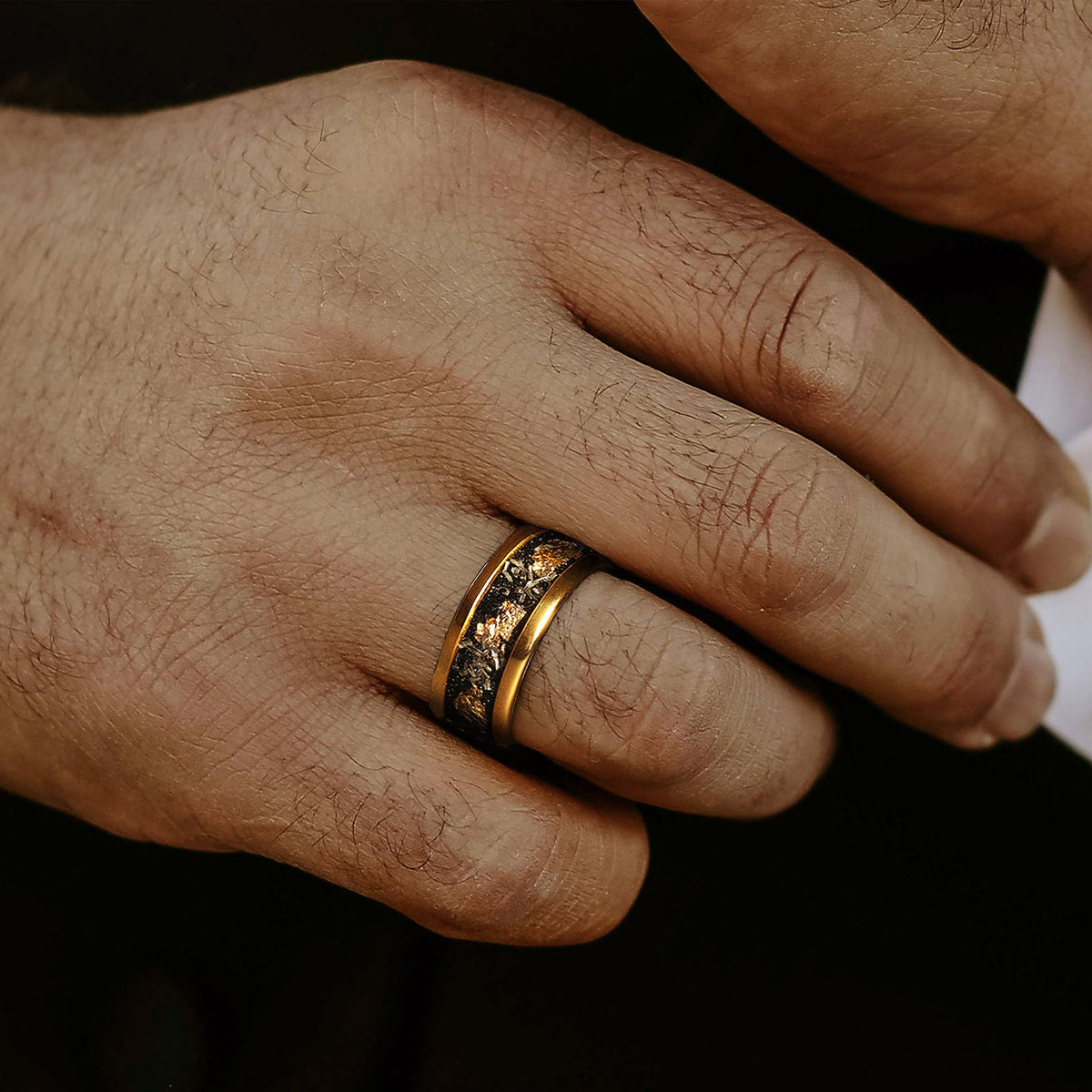 Men’s yellow gold tungsten ring with obsidian meteorite and gold leaf