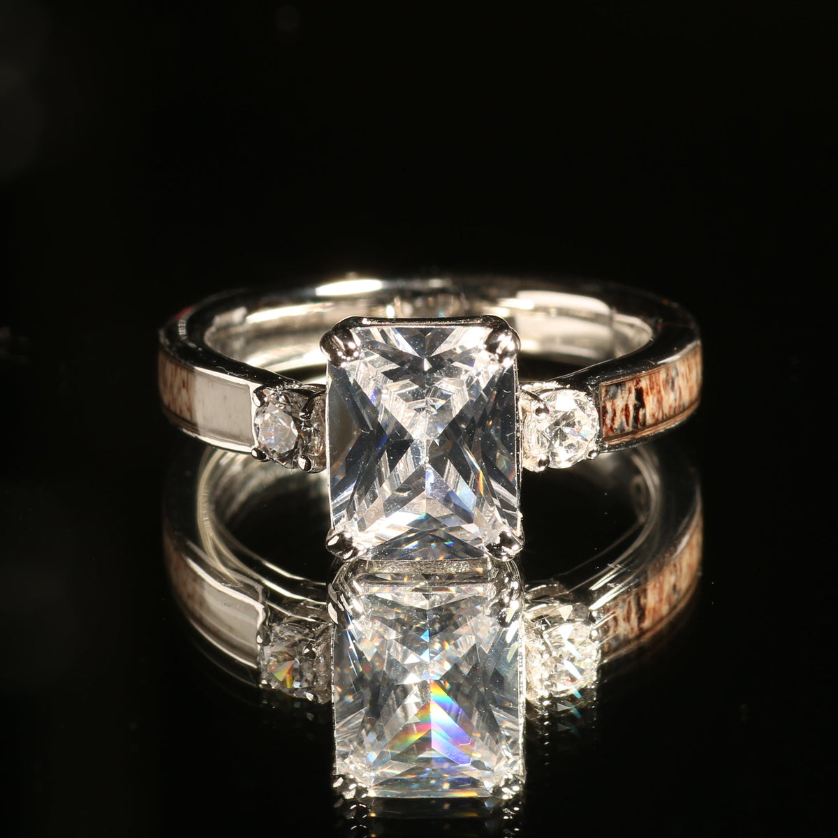 Women’s sterling silver deer antler ring with radiant cut stone