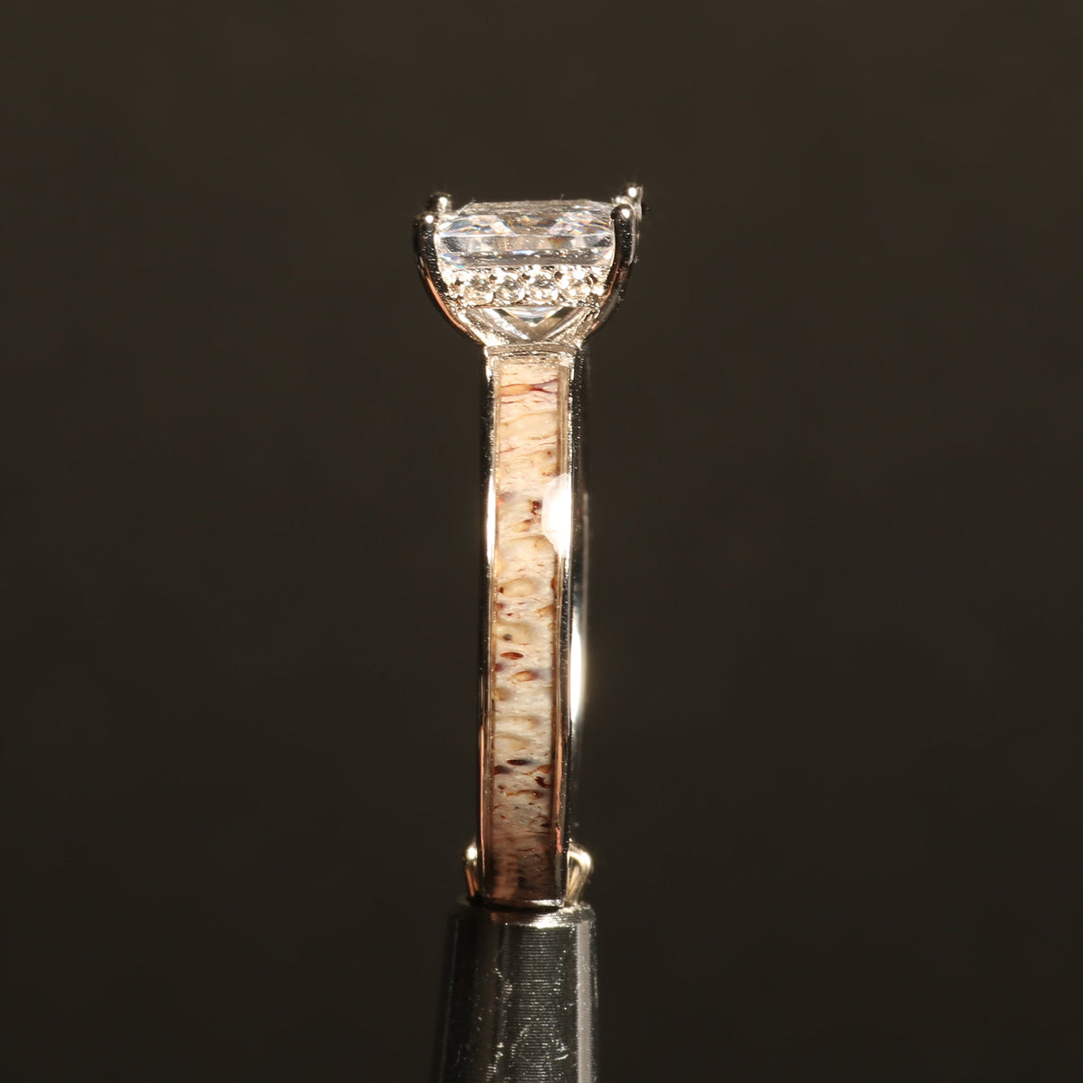 Women’s sterling silver ring with deer antler and princess cut stone
